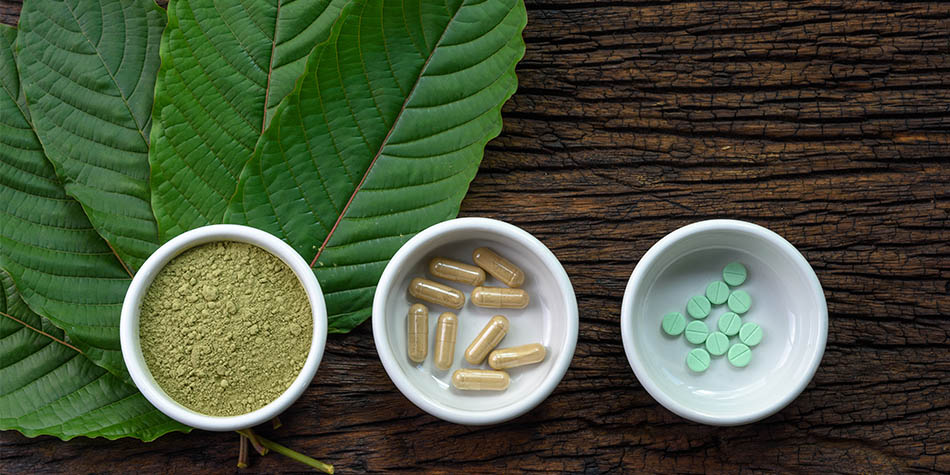green photo of kratom in plant, tea and pills