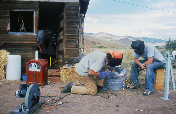 young men learning to weld
