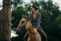 Woman riding horeseback