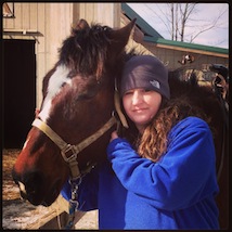 Girl posing with horse