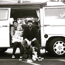 Black and white image of family sitting in van