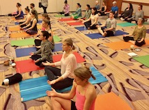 Group of students practicing meditation