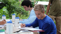Students studying at table outside