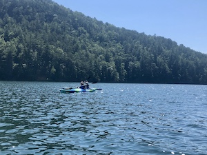 Photograph of Foundations Asheville students kayaking on a lake in NC.