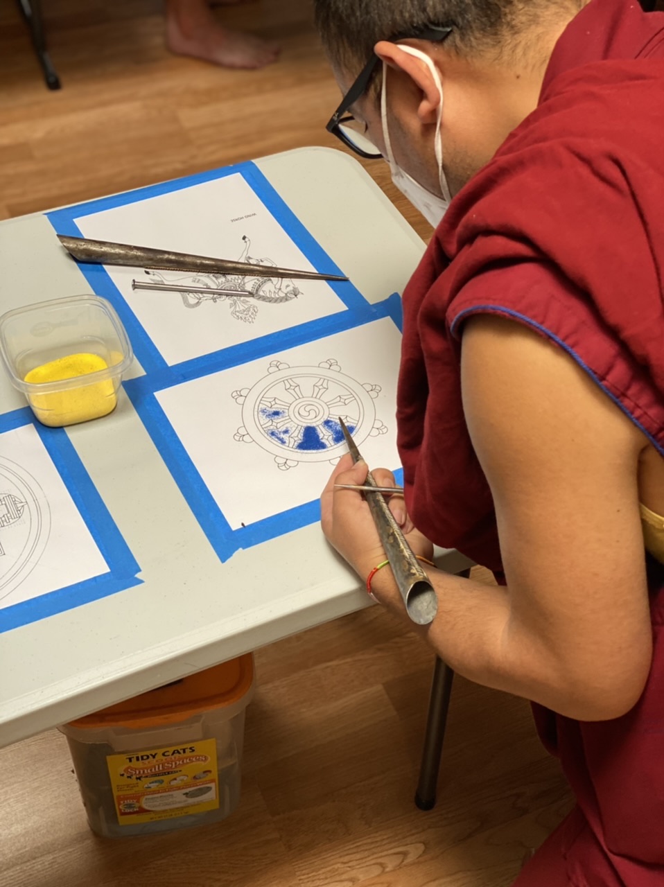 Photo of a Monk doing art.
