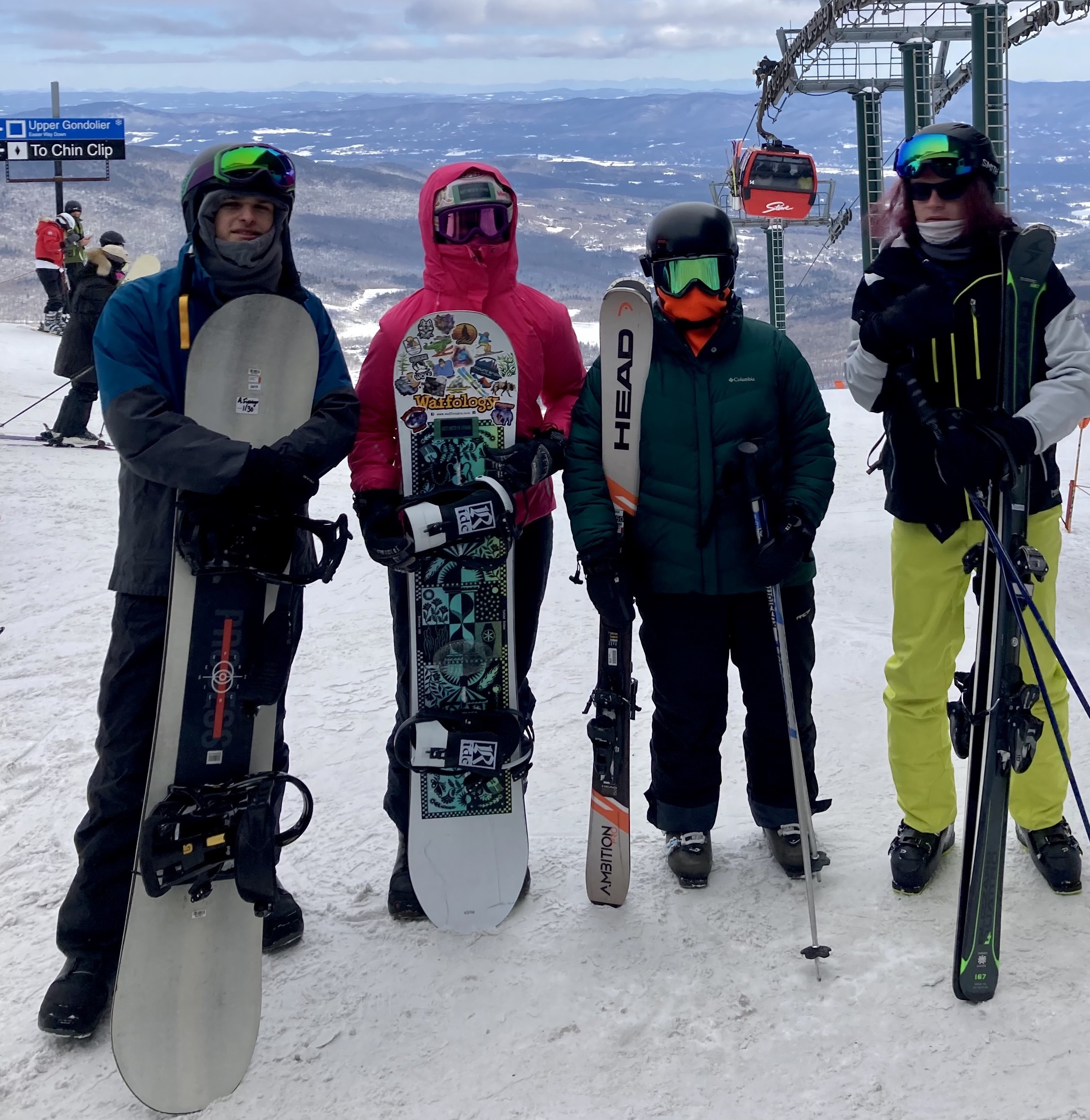 photo of 4 Mountain Valley Treatment Center students with skis & snowboards